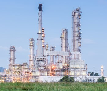 Exterior view of a large industrial plant with several towers